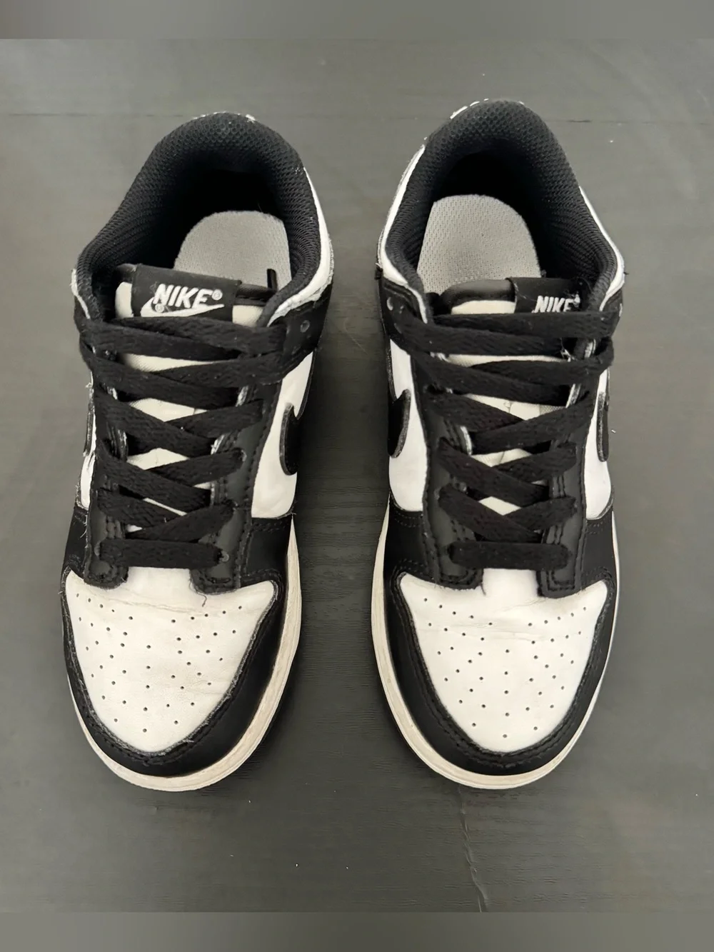 Children’s Nike Dunk Low black and white tennis shoes